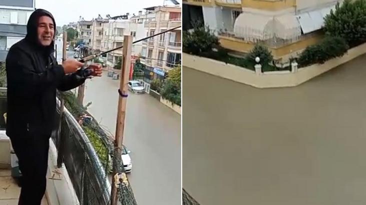 Ünlü tatil beldesinde yollar göle dönünce balkonundan sokağa olta attı